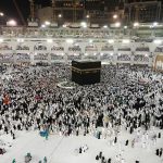 From above of crowded square around Kaaba cube in Great Mosque of Mecca at night time