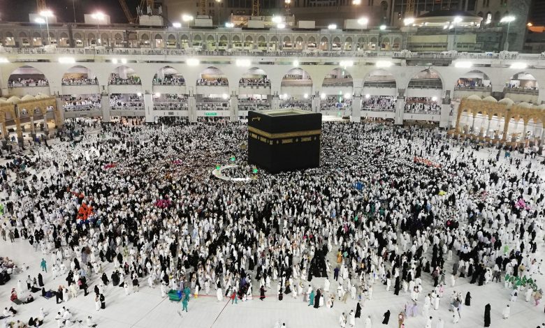 From above of crowded square around Kaaba cube in Great Mosque of Mecca at night time