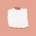white and blue paper on pink surface
