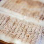 a close up of a book with writing on it